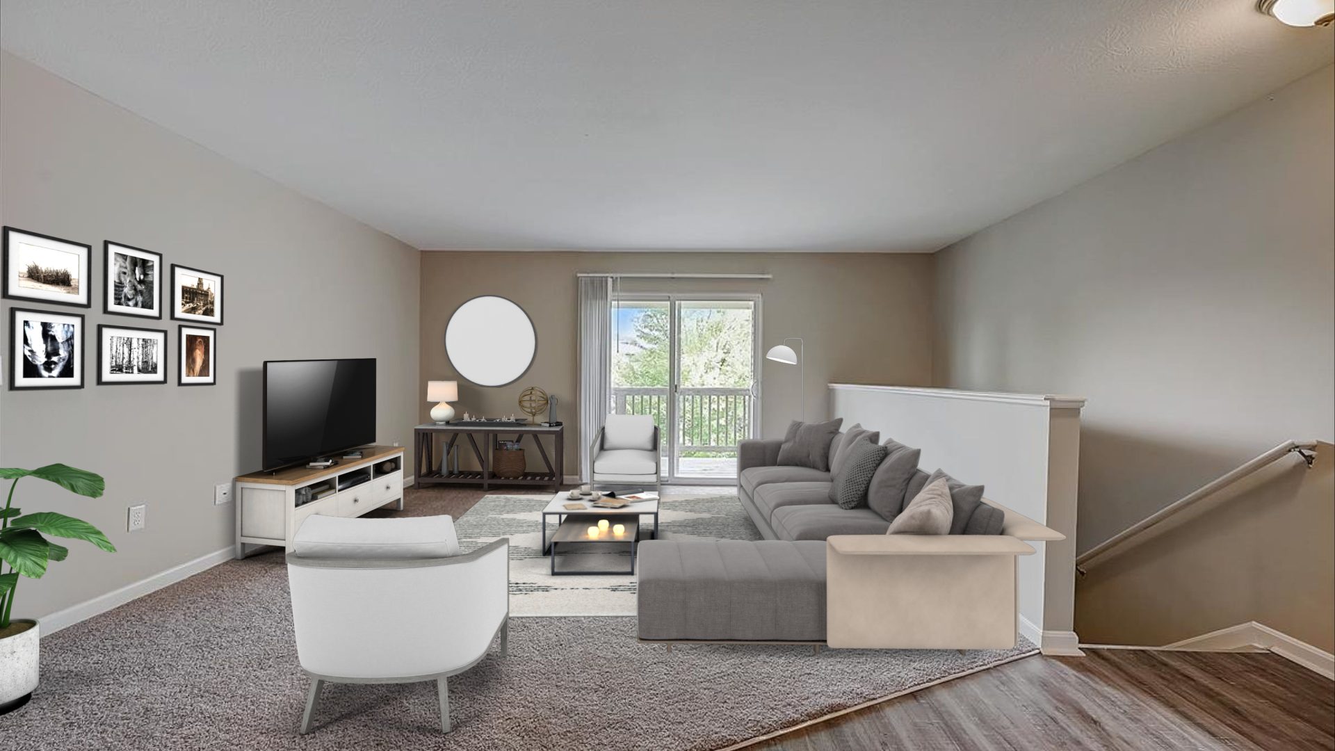 a living room with a couch, coffee table and television at The Worthington Green