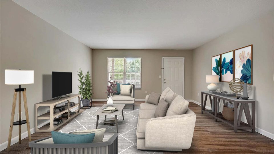 a living room with a couch, coffee table and television at The Worthington Green