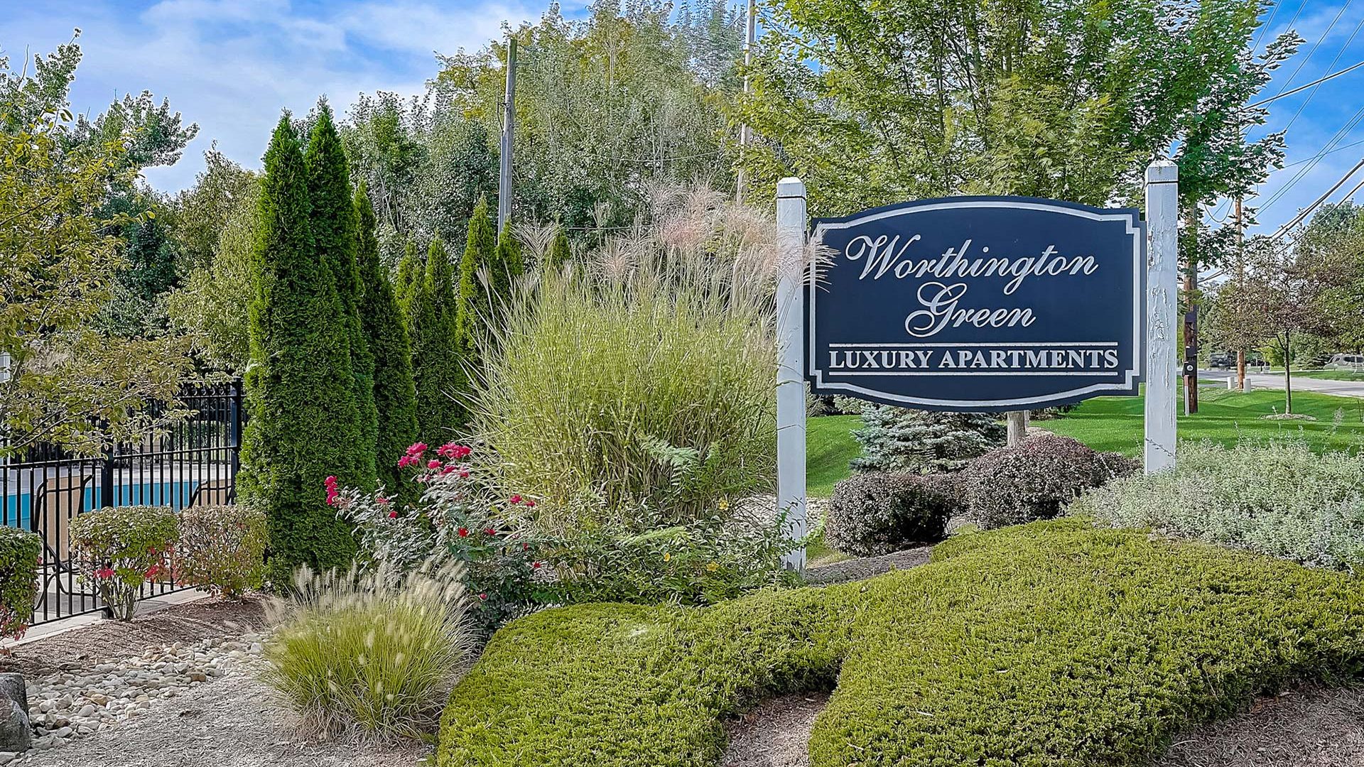 the sign for washington village apartments at The Worthington Green